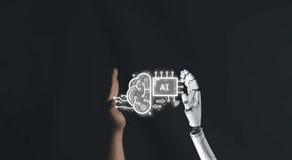 A MacBook with lines of code on its screen on a busy desk